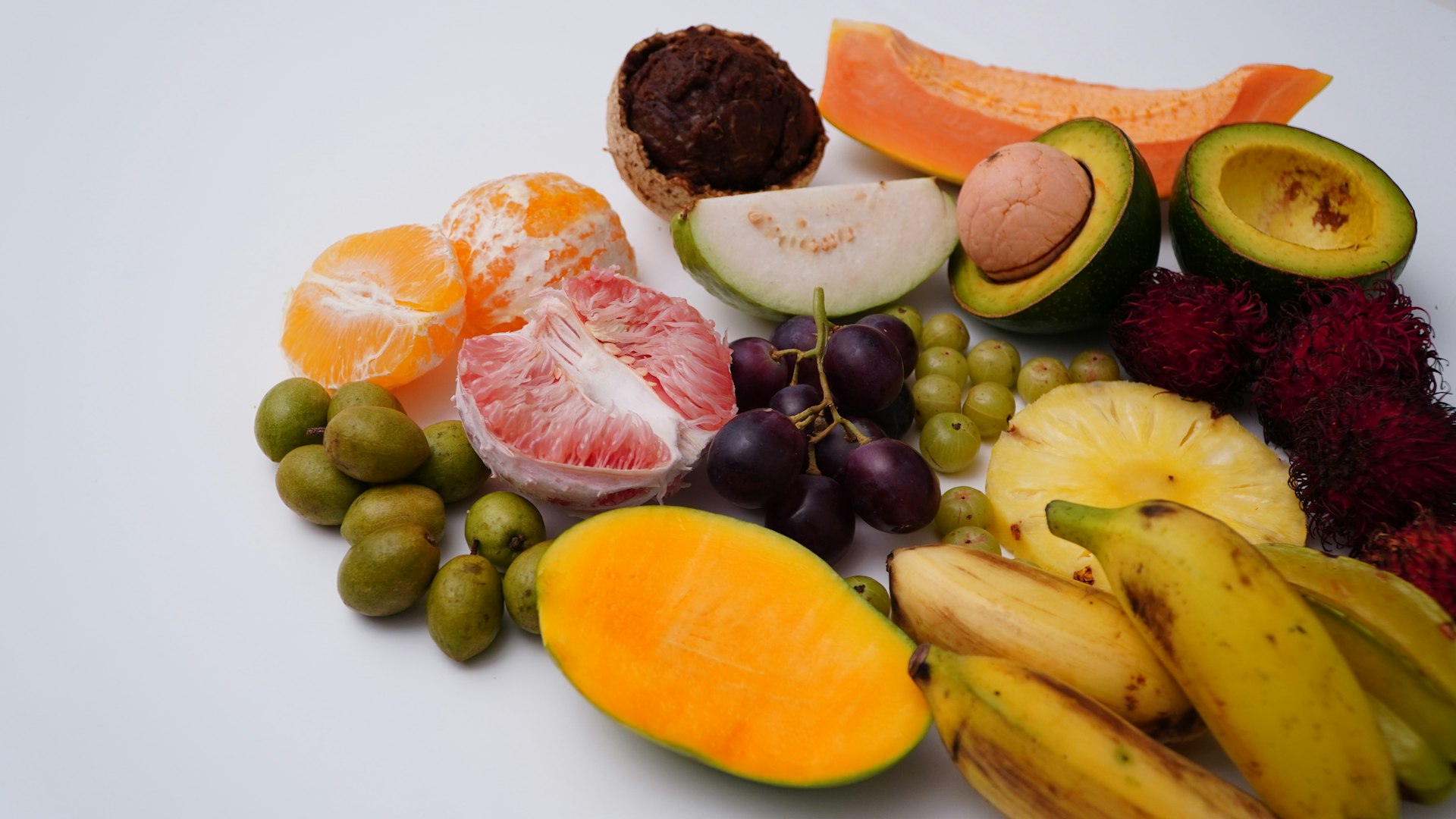 sliced orange fruit and grapes
